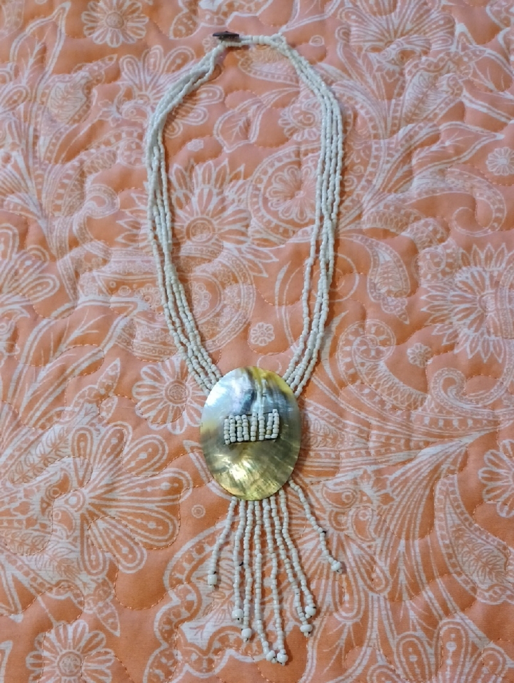 White Multi-strand Beaded Shell Pendant Necklace.